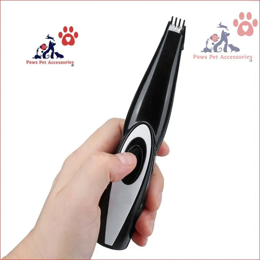 Black and silver electric pet nail trimmer held in hand, perfect pet grooming tool