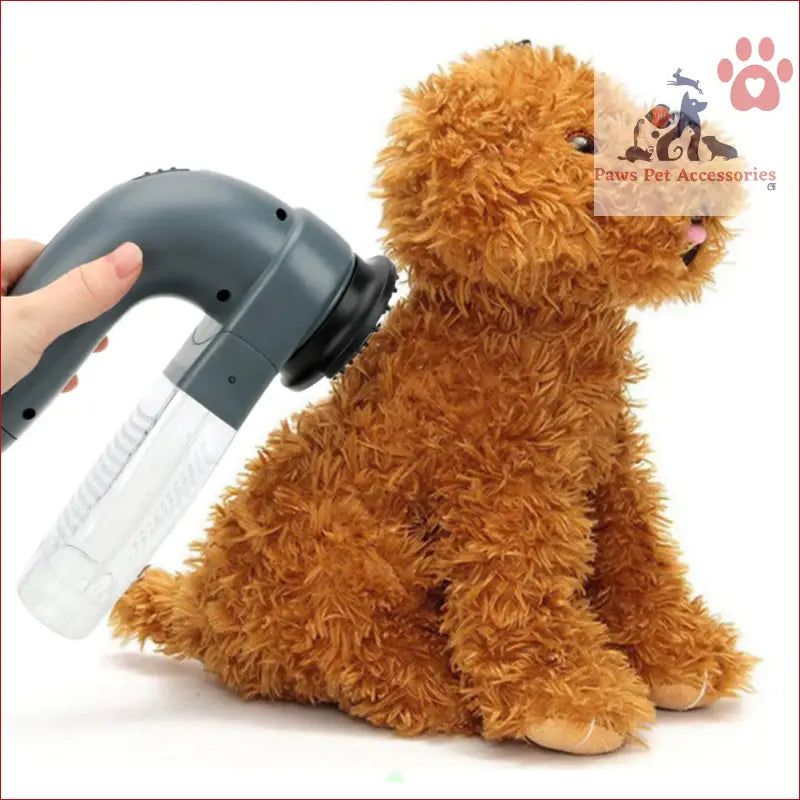 Brown plush teddy bear getting groomed with a Battery Operated pet hair vacuum