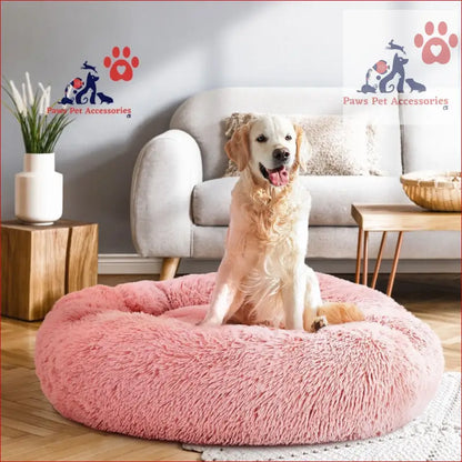 Happy Golden Retriever lounging on a large calming soft pink pet bed dog 90cm