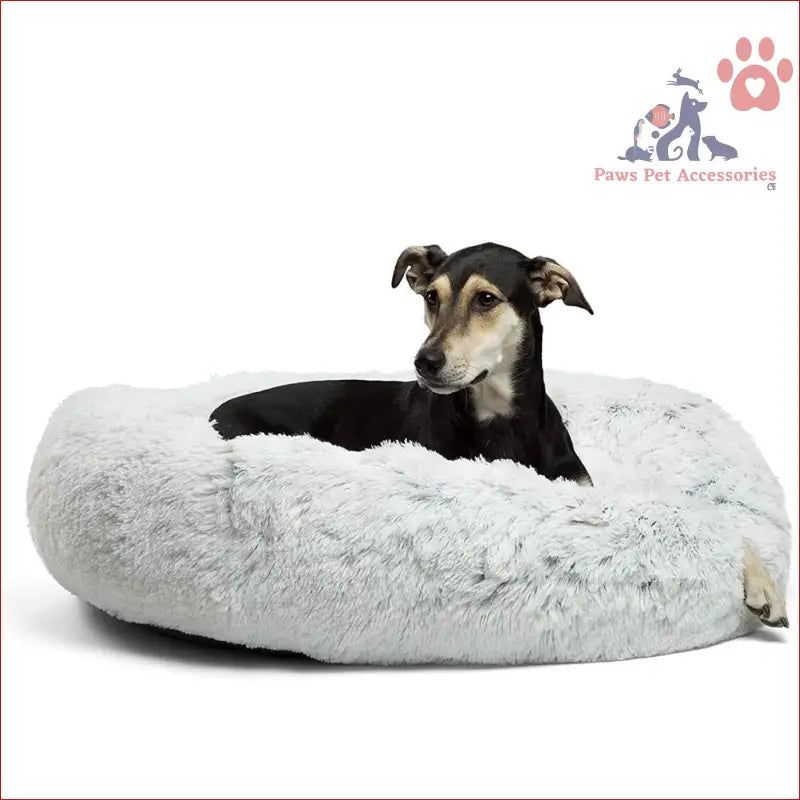 Black and tan dog chilling in a fluffy washable calming donut pet bed