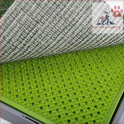 Bright green dog potty tray with raised spikes and drainage channels for training indoors