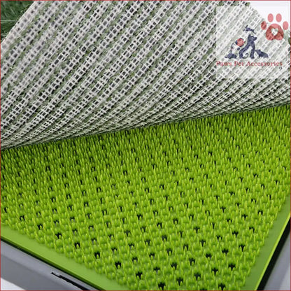 Bright green drying rack with spikes for holding dishes in Pet Dog Potty Tray Training