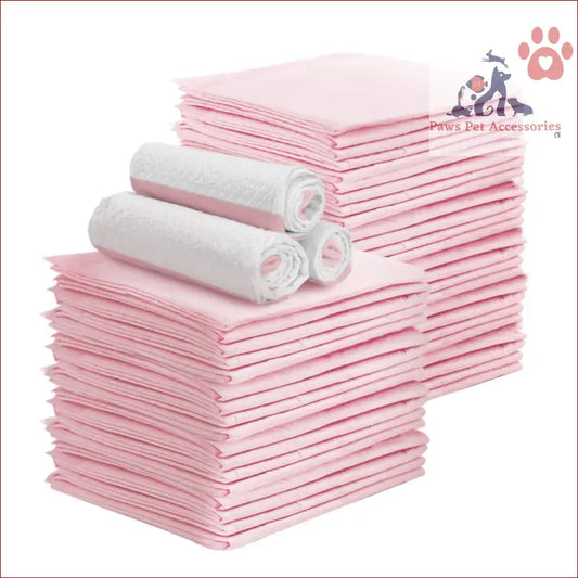 Stack of pink pet training pads with white absorbent rolls, perfect for indoor use