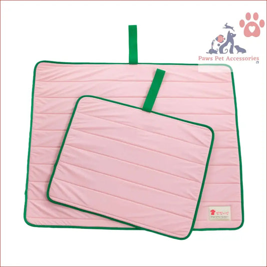 Pink quilted dog cooling mat with green trim, perfect for travel roll and outdoor use