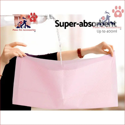 Pink absorbent cleaning cloth tested with water, perfect for i.Pet Training Pads 200pcs