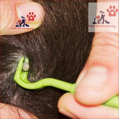 Bright green Mitey Tick Free Tick Remover Kit tool in action on dark fur coat