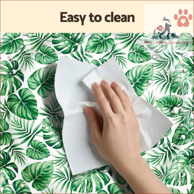 Hand wiping a surface with a cloth next to a Pet Cooling Mat Gel for puppies