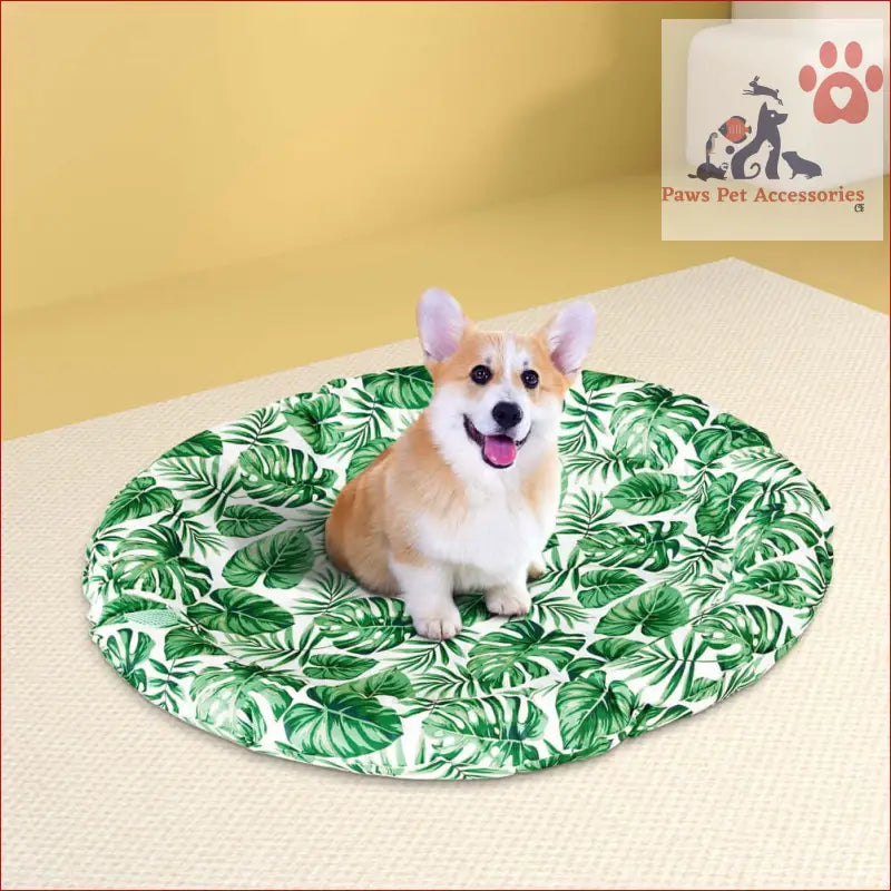 Happy Corgi chilling on a pet cooling mat gel cushion in a tropical leaf print