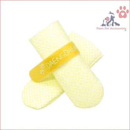 Yellow and white knitted mittens with a branded band, perfect for cozy winter days