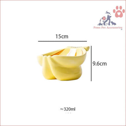 Yellow ceramic elevated pet food bowl with wavy edges, featuring a cute banana pattern