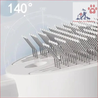 Metal bristles at 140 degrees on a White Pet Grooming Spray and Massage Brush