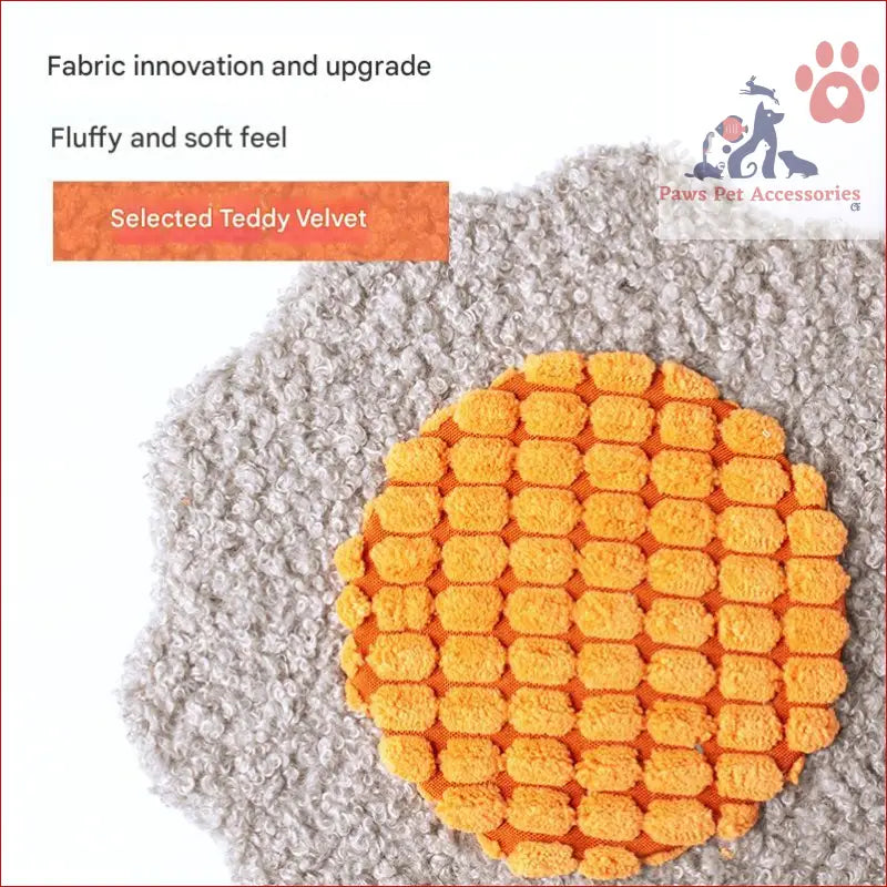 Orange waffle-textured circular cushion with gray fluffy border for interactive cat scratching