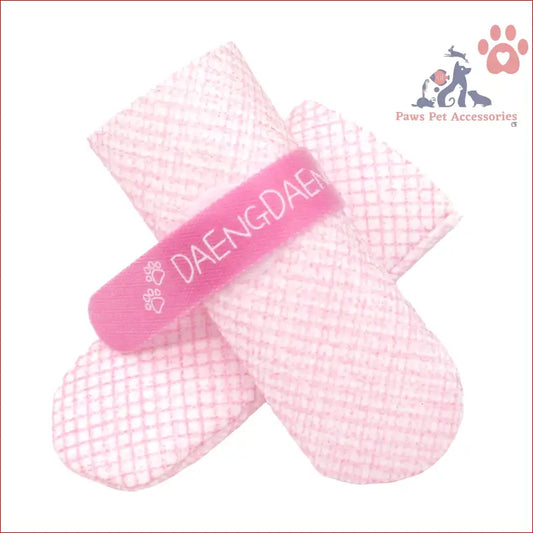 Pink bandage on dog shoes waterproof with DAENGDAE text for style and grip