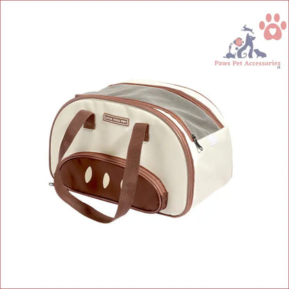 Cream and brown large capacity cat carrier bag with ventilation holes and handles