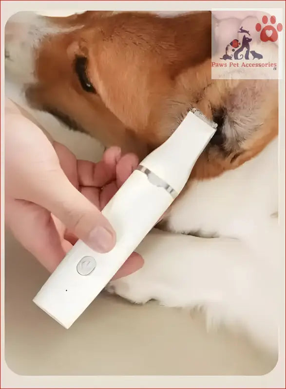 White electric nail grinder in use on a dog’s paw with Blue T70 4-in-1 Pet Grooming Kit