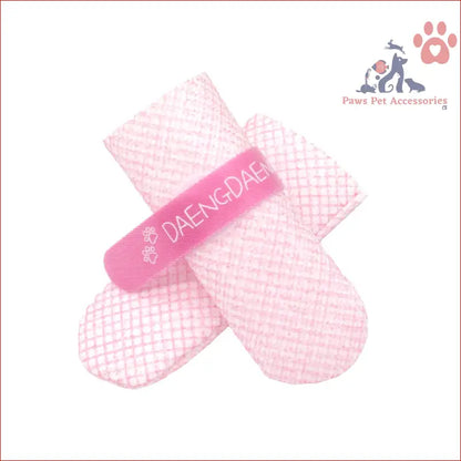 Pink adhesive bandage with texture on 28pc waterproof disposable boots for dogs