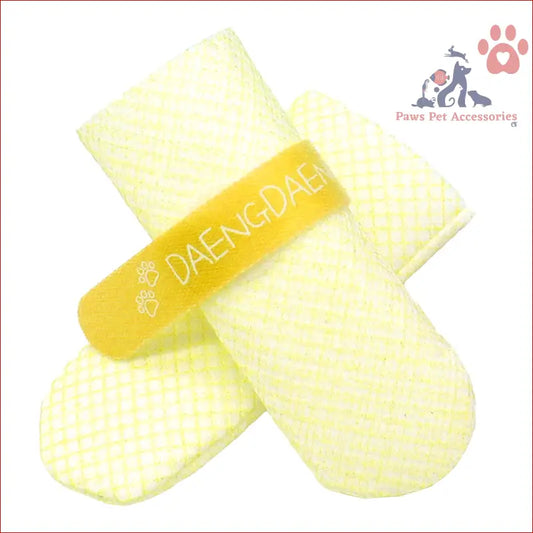 Yellow and white knitted mittens with DAENKDAE text for dog shoes waterproof style